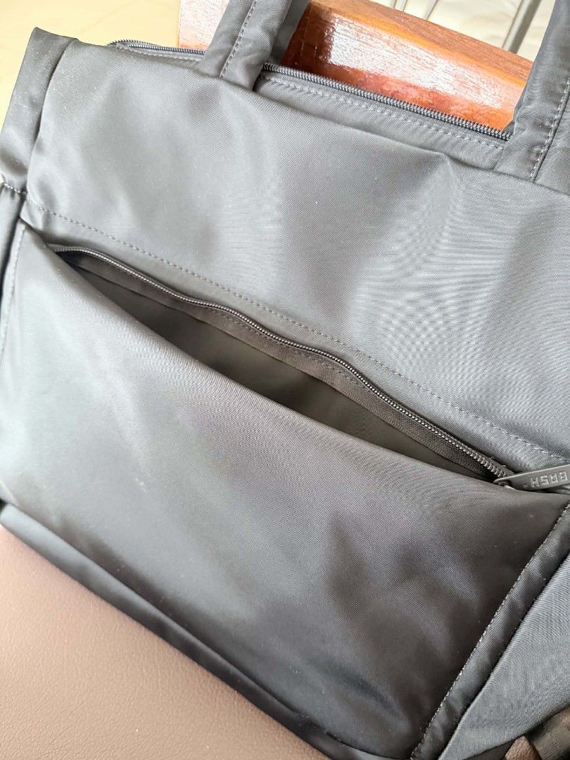 BASH Black Puffer Tote Bag (Category: Tote Bags) located in Caloocan City. Submitted by jennraean (Listing ID 1466235115, Image 2). Description: - Brand: BASH - Color: Classic Black - Material: Soft, lightweight padded puffer - Closure: Secure top zip - Pockets: Front zipper pocket Almost new No flaws All zippers are working No scratches Still With keyleash .