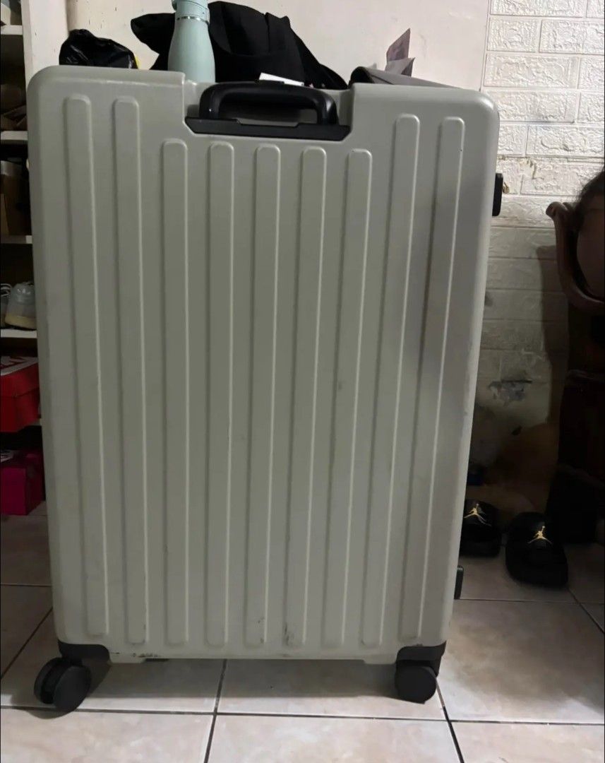 Bash Grey Hard Shell Luggage Suitcase (Category: Luggage) located in Manila. Submitted by ann261 (Listing ID 1466227025, Image 3). Description: - Brand: BASH - Color: Light Grey - Material: Durable hard shell with stylish vertical ribbed design - Mobility: Smooth-rolling wheels with top and side carry handles - Security: Built-in side combination lock - Interior: Multiple zippered mesh compartments, compression straps, and clean fabric lining - C