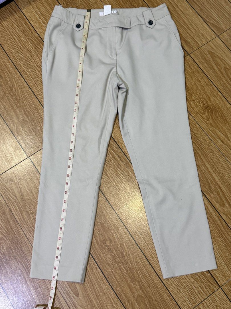 Beige trousers with front button details (Category: Jeans) located in San Pedro. Submitted by skirtlotso (Listing ID 1466205350, Image 1). Description: - Color: Versatile neutral beige - Style: Straight-leg trousers, great for work or casual days - Closure: Front zip with two stylish dark buttons on the waistband - Waist: Approx. 15 inches across - Length: Approx. 35 inches total - Condition: Clean fabric, ready to wear.