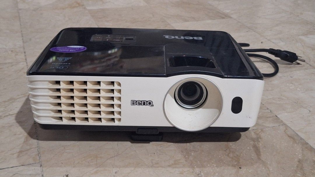 BenQ MX660P Digital Projector (Category: Projectors) located in Angeles City. Submitted by pamdiel003 (Listing ID 1466222209, Image 2). Description: - Model: BenQ MX660P Digital Projector - Condition: Powers on and projects normally - Design: Black and white housing with top control buttons and front lens - Power: AC 100-240V with attached power cable included - Lamp: Equipped with a Philips UHP lamp unit - Ideal Use: Perfect standard setup for h