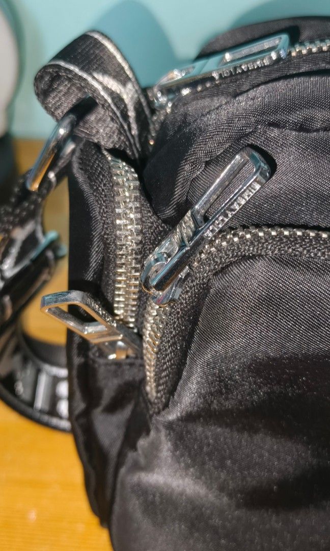 Bimba Y Lola bag nylon (Category: Cross-body Bags) located in Rizal. Submitted by baltiq (Listing ID 1466182440, Image 3). Description: nylon bag Bimba Y Lola ✔classic black with silver hardwares - brand engraved ✔wide shoulder strap, adjustable ✔multiple compartments, all zip closure 📌can pass as b'new, malinis labas at loob 📌bigay lang saken, used twice 💰MOP: GCash.