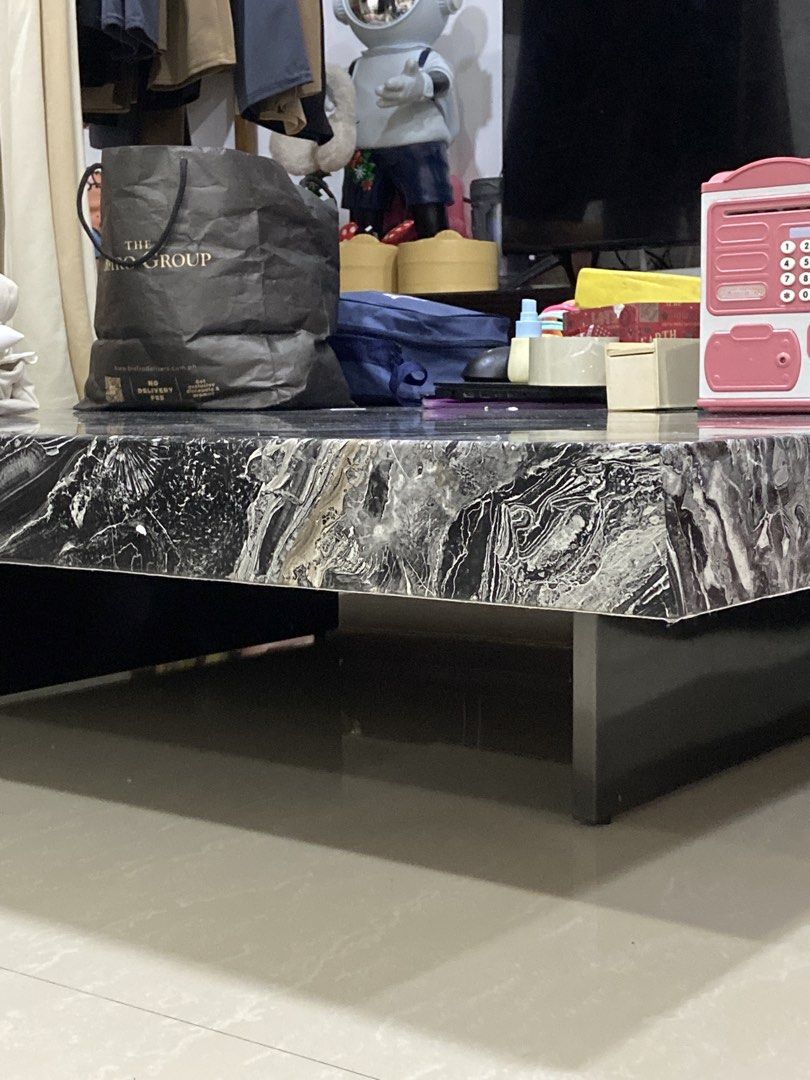 Black and White Marble Pattern Coffee Table (Category: Tables & Sets) located in Manila. Submitted by sharry24 (Listing ID 1466158181, Image 2). Description: Good as new! Marble talaga Large square coffee table with a striking black and white marble pattern top - Sleek low-profile design with dark side supports for a modern look - Sturdy and durable build with a substantial surface area for drinks, books, and decor - Neutral monochrome tones easi