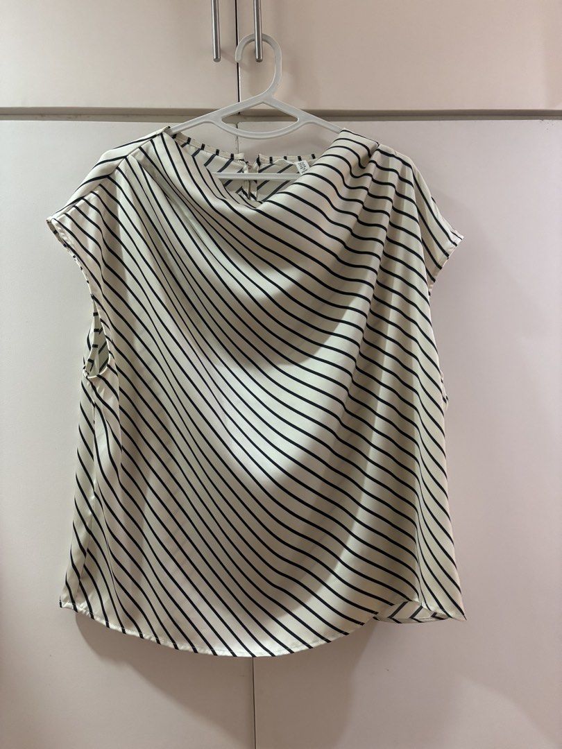 Black and White Striped Sleeveless Blouse (Category: Sleeveless) located in Las Pinas. Submitted by misg0905 (Listing ID 1466244103, Image 1). Description: - Color/Pattern: Black and white diagonal stripes - Style: Sleeveless top with an elegant cowl neckline - Material: Lightweight and comfortable fabric - Condition: Great overall, clean, and ready to wear.