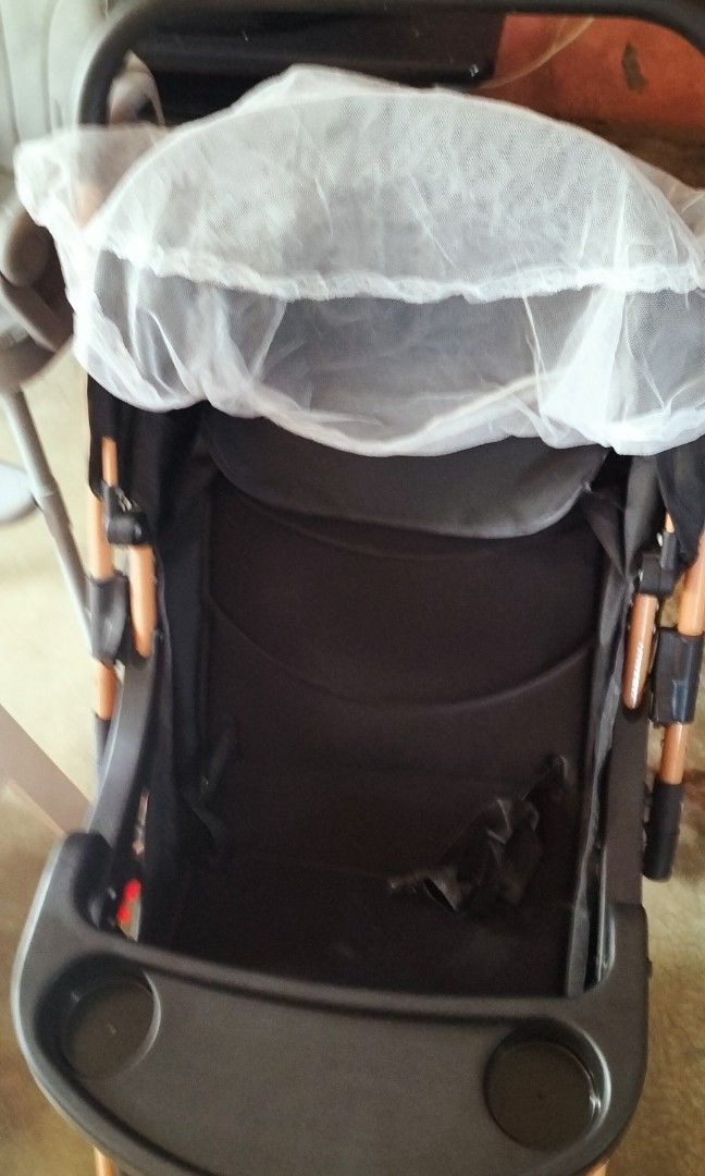 Black Baby Stroller with Tray and Cup Holder (Category: Strollers) located in Manila. Submitted by tiffanyonhand (Listing ID 1463346231, Image 3). Description: - Stylish black baby stroller - Chic rose gold frame - Convenient tray with cup holder - Secure 5-point harness for child's safety - In good, pre-loved condition - Ideal for daily walks and outings - Ready for a new loving home.