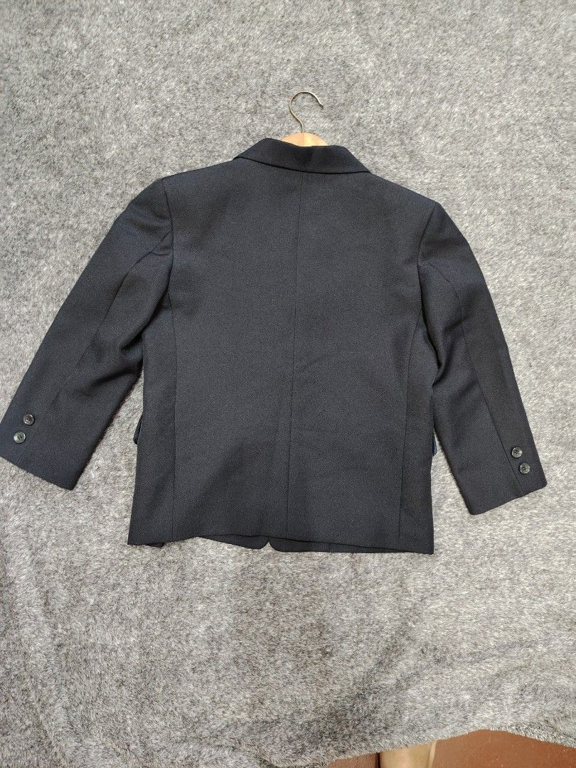 Black Coat Small (Category: Coats, Jackets and Outerwear) located in Valenzuela. Submitted by anna.banana10 (Listing ID 1466163225, Image 2). Description: - Brand/Model: New Royal Childrens Wear black suit coat - Size: Small - Design: Classic three-button front closure, notched lapel, flap pockets, and single chest pocket - Interior: Smooth blue lining - Condition: Clean inside and out, no flaws found - Ideal for: Formal events, parties, or schoo