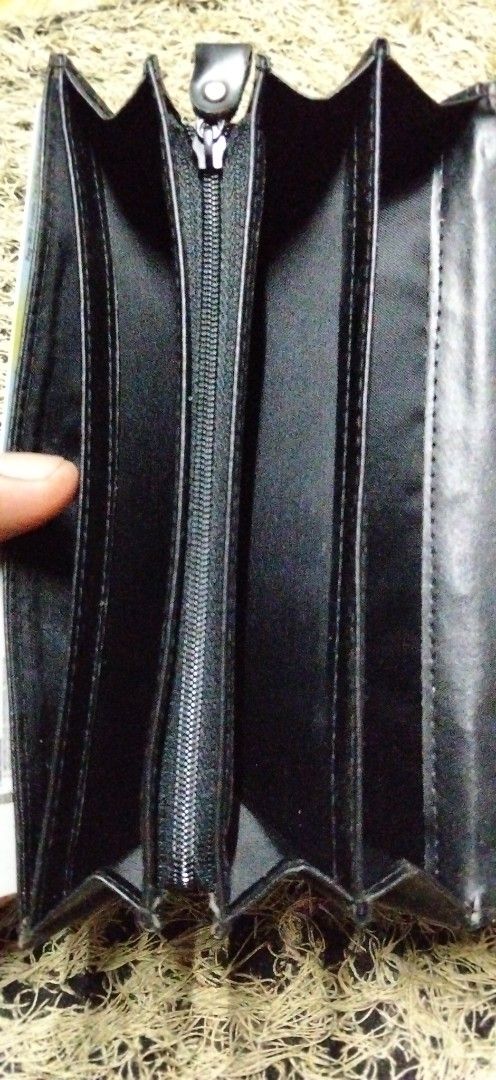 Black crocodile embossed long wallet with multiple card slots (Category: Wallets & Card holders) located in Paranaque City. Submitted by michael-08 (Listing ID 1466190633, Image 3). Description: - Stylish black long wallet with a trendy faux crocodile texture - Secure snap button front flap closure - Spacious interior with multiple card slots and clear ID windows - Includes accordion gusset compartments and a convenient middle zippered pocket - C