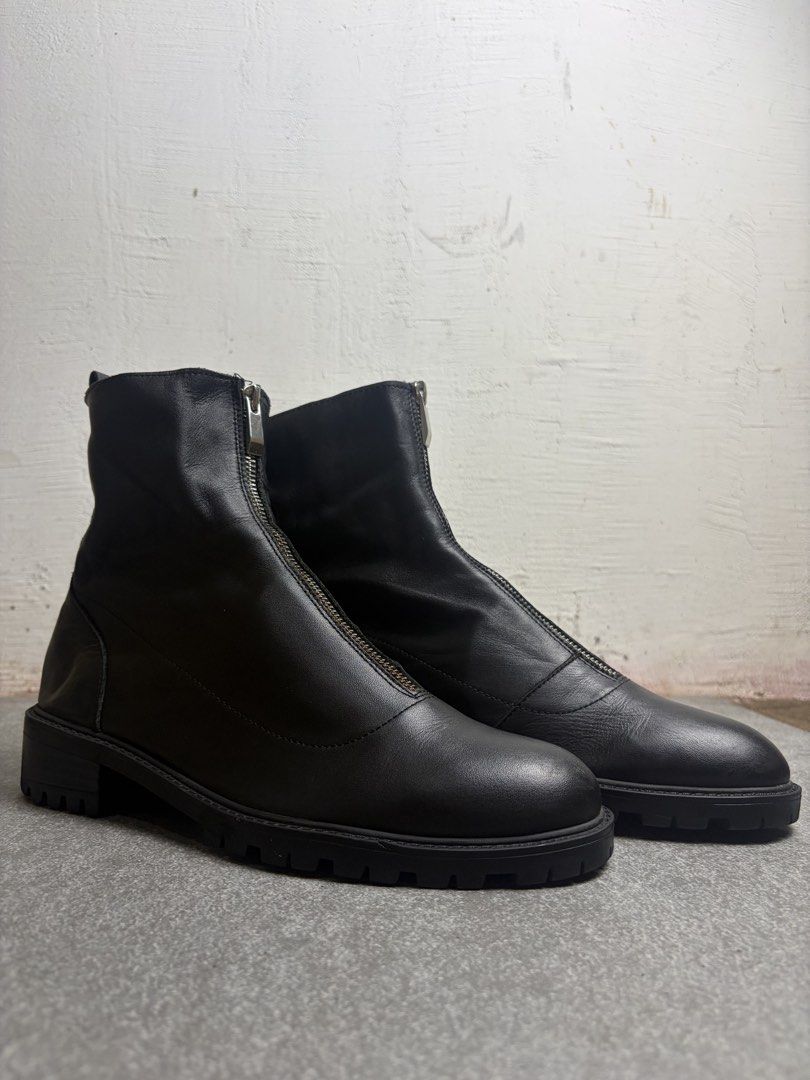 Black leather front zip ankle boots chunky lug sole (Category: Boots) located in Cagayan de Oro. Submitted by taramattsa45690 (Listing ID 1466157766, Image 1). Description: - Style: Minimalist black leather ankle boots - Closure: Convenient front zipper with back pull tabs for easy slip-on wear - Sole: Chunky lug sole for solid, everyday traction - Toe: Classic round toe design - Versatility: Highly versatile and easy to match with different outf