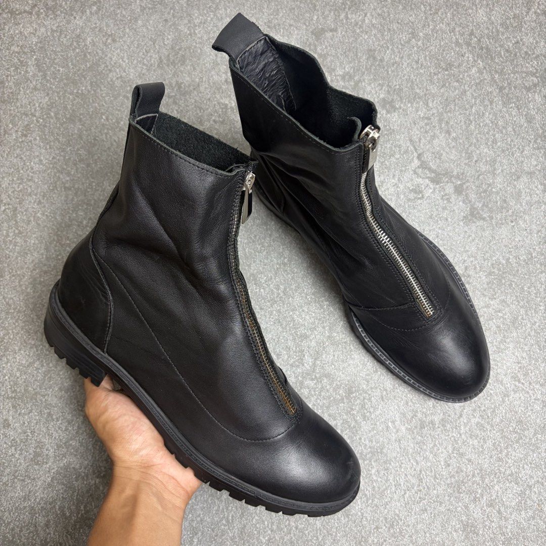 Black leather front zip ankle boots chunky lug sole (Category: Boots) located in Cagayan de Oro. Submitted by taramattsa45690 (Listing ID 1466157766, Image 3). Description: - Style: Minimalist black leather ankle boots - Closure: Convenient front zipper with back pull tabs for easy slip-on wear - Sole: Chunky lug sole for solid, everyday traction - Toe: Classic round toe design - Versatility: Highly versatile and easy to match with different outf