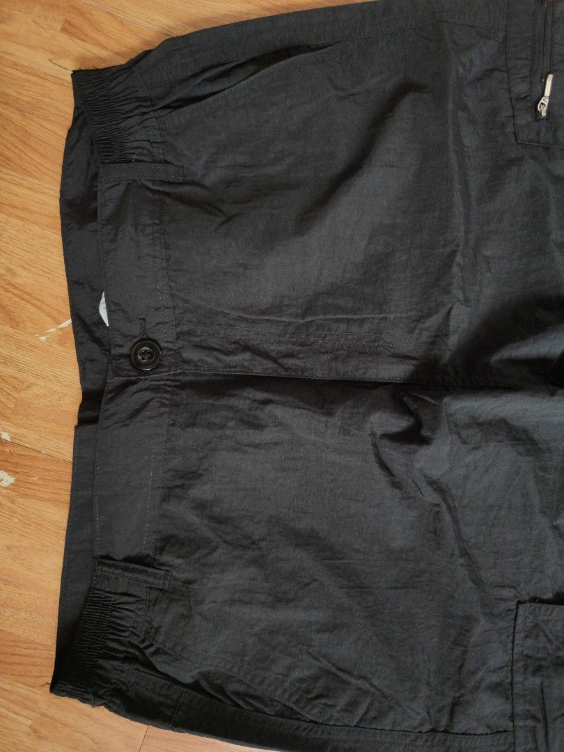 Black Nylon Multi-Pocket Cargo Utility Pants (Category: Joggers) located in San Pablo. Submitted by greatfindsspc (Listing ID 1466216453, Image 3). Description: Upgrade your streetwear or outdoor wardrobe with these highly functional black multi-pocket cargo pants. Made from a lightweight, crisp polyamide/nylon fabric, these tactical utility pants feature a comfortable partially elasticated waistband and an array of storage options, including sec