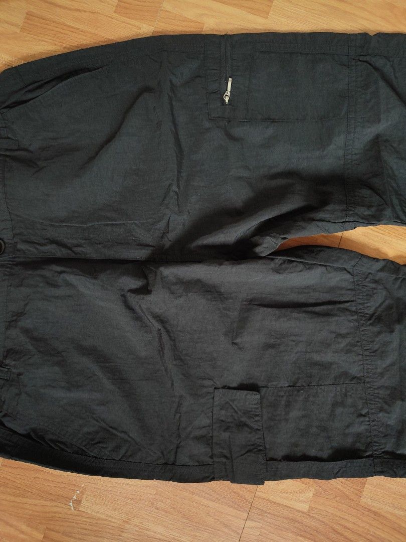 Black Nylon Multi-Pocket Cargo Utility Pants (Category: Joggers) located in San Pablo. Submitted by greatfindsspc (Listing ID 1466216453, Image 2). Description: Upgrade your streetwear or outdoor wardrobe with these highly functional black multi-pocket cargo pants. Made from a lightweight, crisp polyamide/nylon fabric, these tactical utility pants feature a comfortable partially elasticated waistband and an array of storage options, including sec