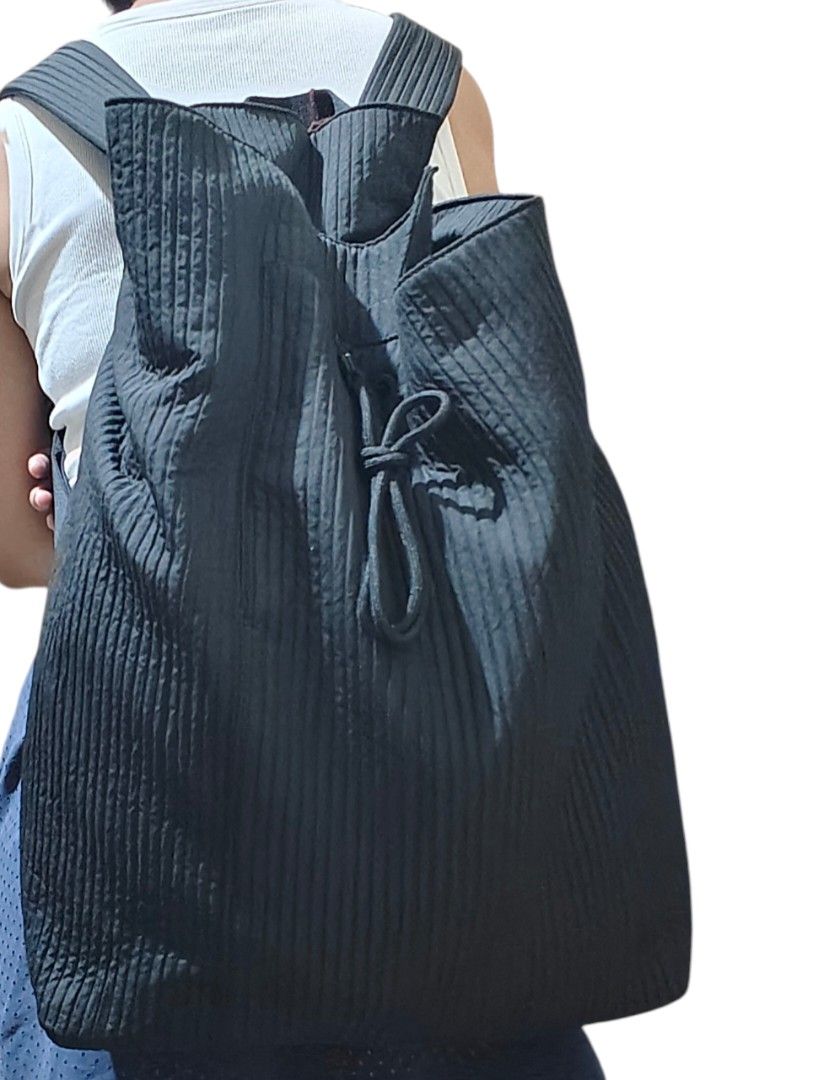 Urban Revivo Black Pleated Backpack with Drawstring Closure (Category: Backpacks) located in Munoz. Submitted by harm0nica337 (Listing ID 1466298681, Image 1). Description: - Stylish black backpack featuring a trendy textured pleated design - Secure top drawstring closure with a thick, durable cord detail - Comfortable, wide, and easily adjustable padded shoulder straps (long straps) - Spacious main compartment to easily hold all your daily essen