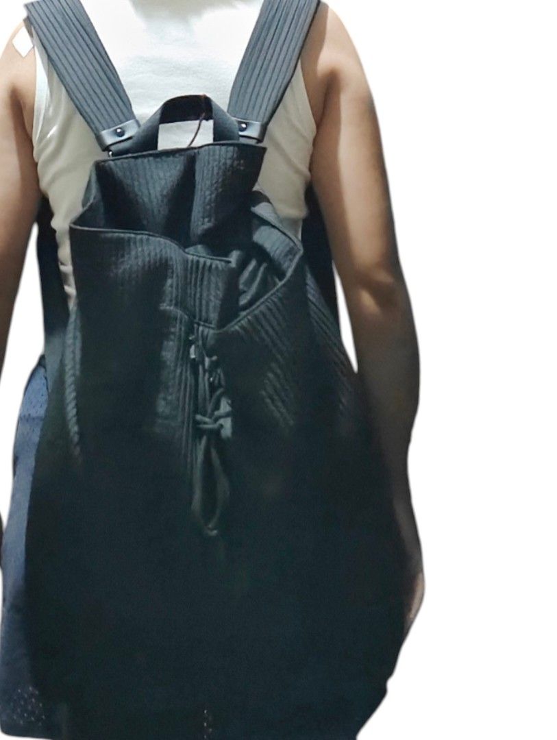 Urban Revivo Black Pleated Backpack with Drawstring Closure (Category: Backpacks) located in Munoz. Submitted by harm0nica337 (Listing ID 1466298681, Image 2). Description: - Stylish black backpack featuring a trendy textured pleated design - Secure top drawstring closure with a thick, durable cord detail - Comfortable, wide, and easily adjustable padded shoulder straps (long straps) - Spacious main compartment to easily hold all your daily essen