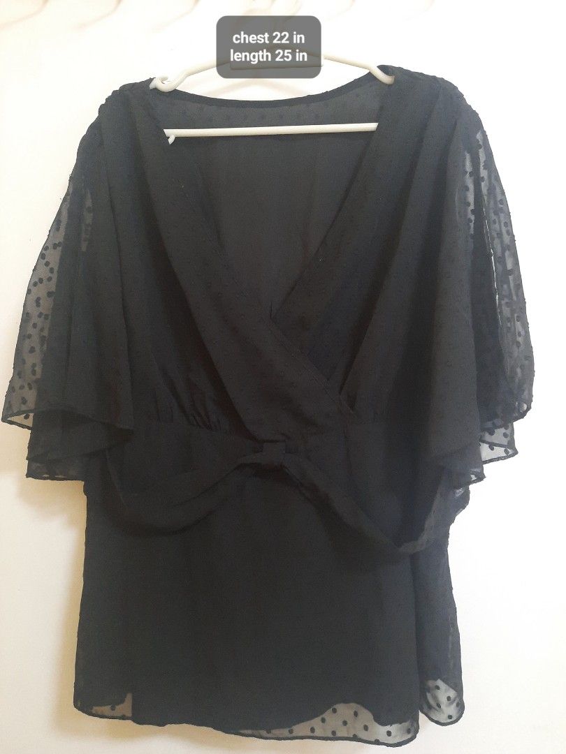 Black Swiss Dot V-Neck Peplum Blouse (Category: Blouses) located in Quezon City. Submitted by dannikkishoppe2 (Listing ID 1466188949, Image 2). Description: Black Swiss Dot V-Neck Peplum Blouse ‼️₱150‼️ Black blouse with sheer Swiss dot fabric and flutter sleeves. V-neck wrap front design. Peplum style with fitted waist and relaxed lower half. Chest measures 22 inches, length is 25 inches..