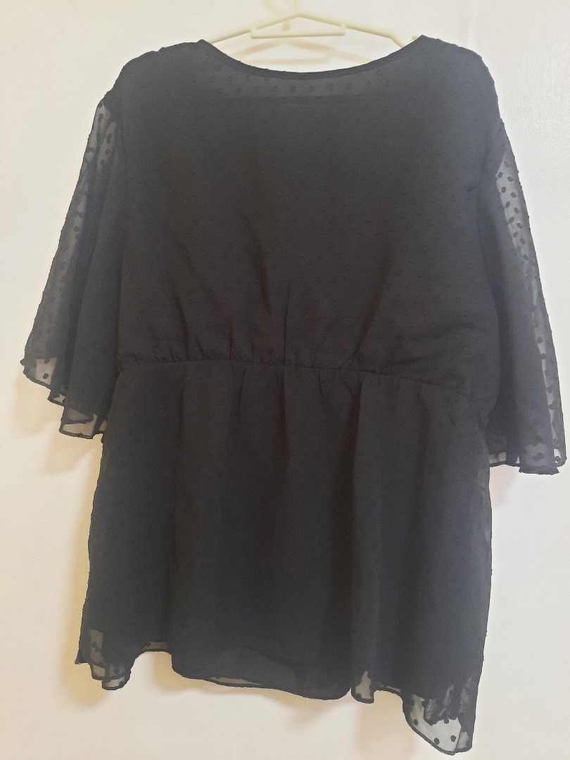 Black Swiss Dot V-Neck Peplum Blouse (Category: Blouses) located in Quezon City. Submitted by dannikkishoppe2 (Listing ID 1466188949, Image 3). Description: Black Swiss Dot V-Neck Peplum Blouse ‼️₱150‼️ Black blouse with sheer Swiss dot fabric and flutter sleeves. V-neck wrap front design. Peplum style with fitted waist and relaxed lower half. Chest measures 22 inches, length is 25 inches..
