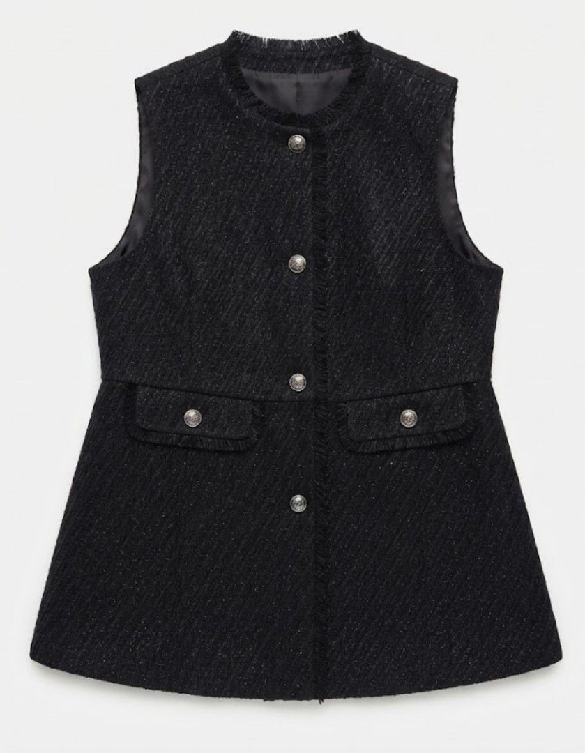 Black Tweed Sleeveless blazer (Category: Sleeveless) located in Donsol. Submitted by saksthriftavenuebyluckymaria8 (Listing ID 1466259010, Image 1). Description: - Style: Black tweed sleeveless vest with subtle metallic threading - Details: Fringe trim on neckline, placket, and pockets with ornate silver-tone metal buttons - Features: Fully lined interior, two front functional pockets - Size: Free Size (F) - Material: Polyester and cotton blend -