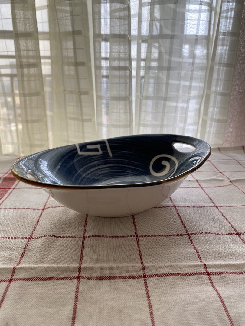 Blue Ceramic Oval Bowl with Handles and Geometric Pattern (Category: Dinnerware & Cutlery) located in Mandaluyong City. Submitted by lovegood711 (Listing ID 1466159687, Image 2). Description: An elegant bowl to display your fruits or pastries, especially for special occasions. - Material: Ceramic - Design: Blue and white with geometric and swirl motifs - Size: Approximately 24 cm across - Features: Two handle cutouts on opposite ends, white exter