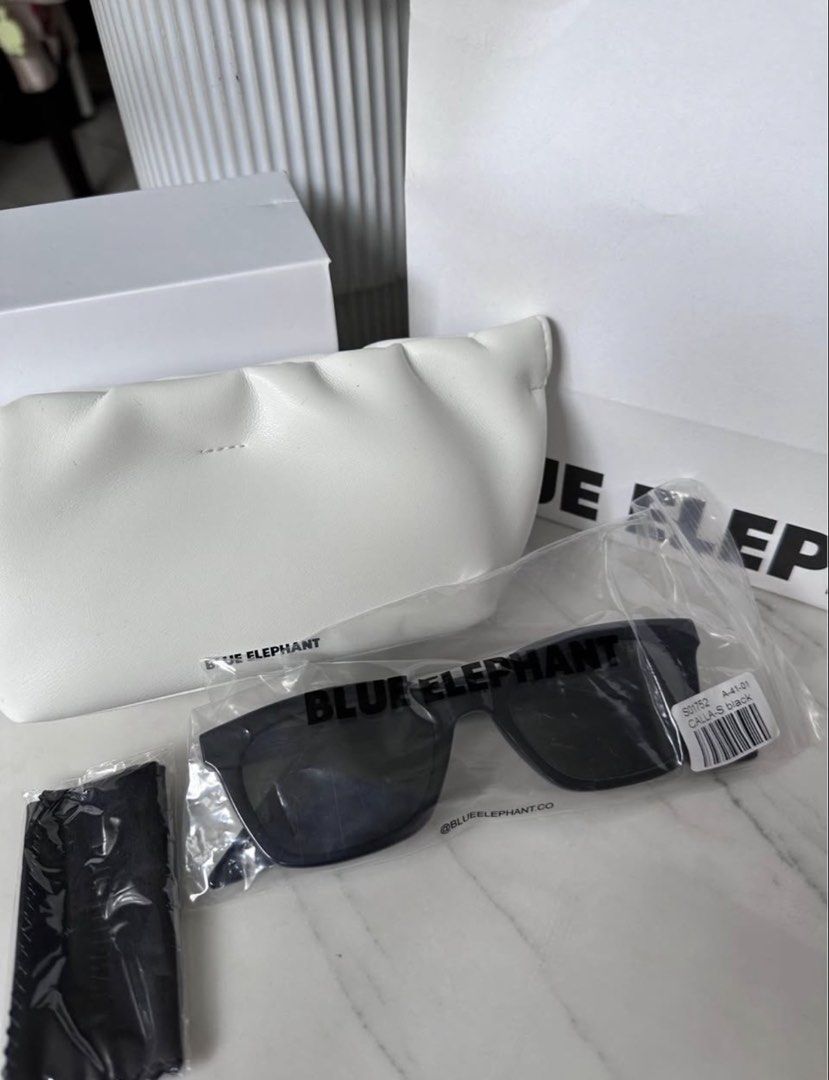 Blue Elephant Calla-S Black Sunglasses (Category: Sunglasses & Eyewear) located in San Juan City. Submitted by jaziman20249087 (Listing ID 1466187466, Image 3). Description: - Brand: Blue Elephant - Model: Calla-S - Color: Classic Black (Chunky acetate frame with dark tinted lenses) - Condition: New, never worn - Inclusions: Original plastic packaging, white leatherette pouch, branded box, authenticity card, cleaning cloth, and paper bag RFS: nev