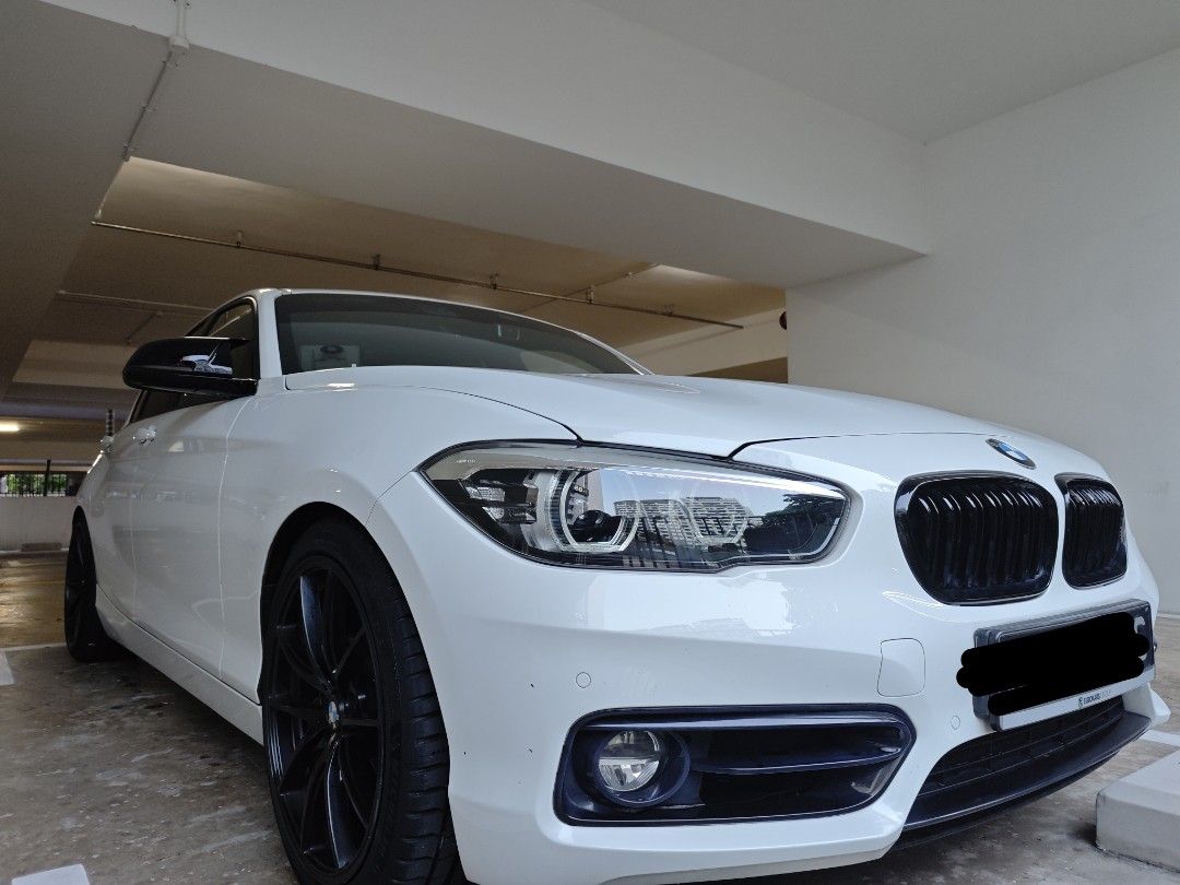 BMW 1 Series Hatchback 118i 5-door Edition Sport (A) (Category: Used Cars) located in Singapore. Submitted by sandycastle (Listing ID 1466308785, Image 1). Description: This is the newer F20 B38 LCI Model, with RWD. Excellent Condition and no accidents. Upgraded to 18" Black Rims, with Brand New Fresh Michelin PS5s tires just installed last month (less than 1k Km). Upgraded with Black spoilers, Side Mirrors, and M-Sport Steering wheel. Bought fro