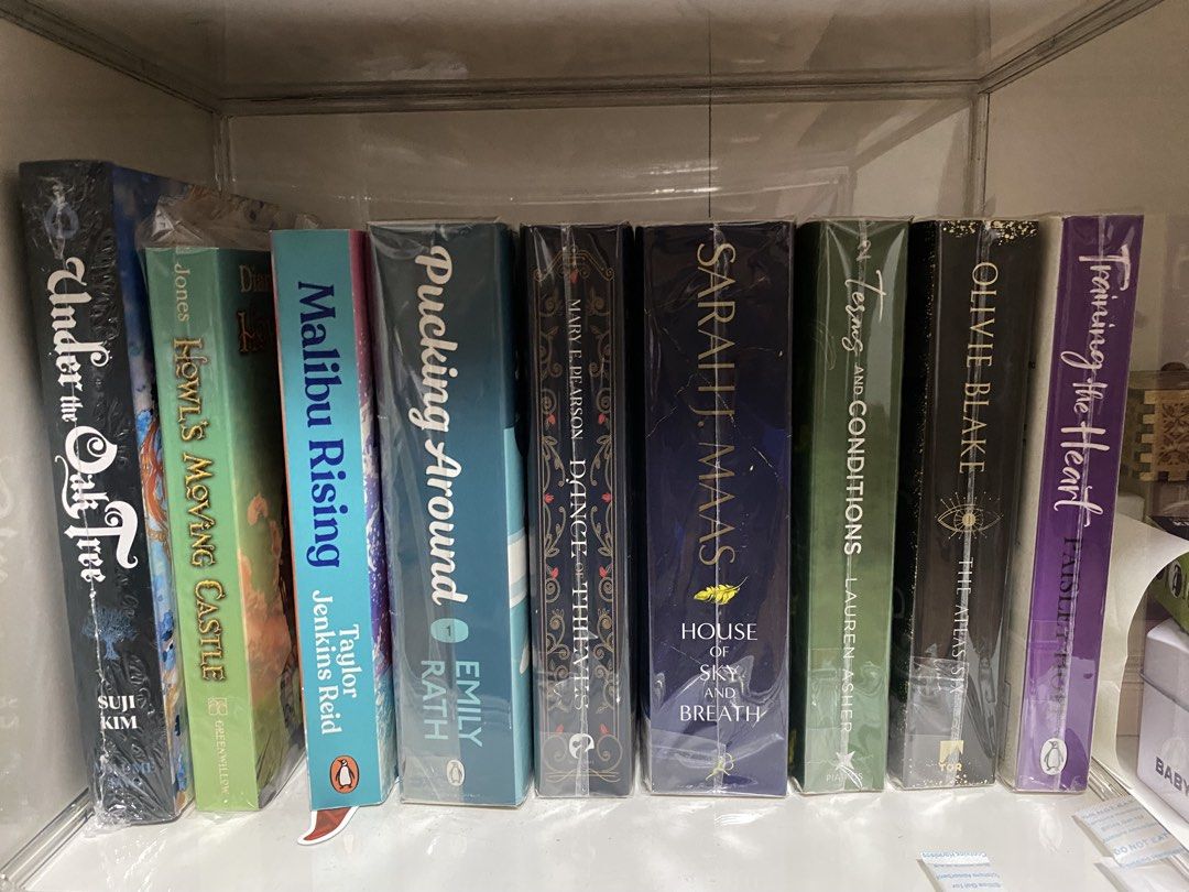 BOOKTOK FOR SALE (Category: Storybooks) located in Bulacan. Submitted by beeucarat05 (Listing ID 1466289882, Image 1). Description: Prices: Under the oak tree volume 2 (sprayed edges) - 1200 Howl’s moving castle - 350 Malibu rising - 250 Pucking around - 500 Dance of thieves - 250 House of sky and breath - 350 Terms and conditions - 250 The atlax six - 250 Training the heart - 350 Metal slinger - 500 Heavenly bodies - 550 Empire of flame and thor