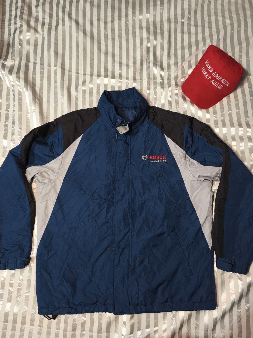 Bosch Corporate Windbreaker Jacket Blue Black (Category: Coats, Jackets and Outerwear) located in Baguio. Submitted by boneteezandharmony (Listing ID 1466330512, Image 1). Description: - Official Bosch windbreaker jacket - Blue body with stylish black and light grey color block panels - Embroidered 'Bosch Invented for life' logo on the left chest - Stand-up collar, full zip closure, and adjustable cuffs - Pit-to-pit: approx. 27 inches - Length: a