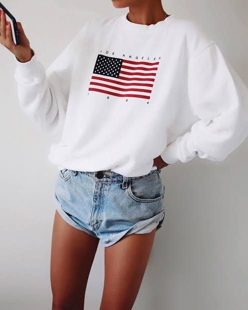 Brandy Melville Sweatshirt (Category: Coats, Jackets and Outerwear) located in Manila. Submitted by she_alice (Listing ID 1466325387, Image 3). Description: - Color: White -Size: Small (Oversized) can fit up to Large - Design: Vintage LA graphic with American flag and '1984' print - Super pretty in actual. 💬 Feel free to message me for any questions 🛵 Can be shipped via Lalamove .
