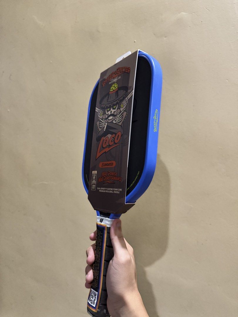 Bread & Butter Loco Elongated Pickleball Paddle (Category: Racket and Ball Sports) located in Pagadian. Submitted by lancism.g (Listing ID 1466333531, Image 2). Description: - Brand: Bread & Butter Pickleball Co. - Model: Loco Elongated - Condition: Brand new, unopened, and unused - Handle: Still has factory plastic wrap and registration QR code sticker - Key Features: Dual-density floating foam core and T-700 raw carbon fiber surface for ultimat