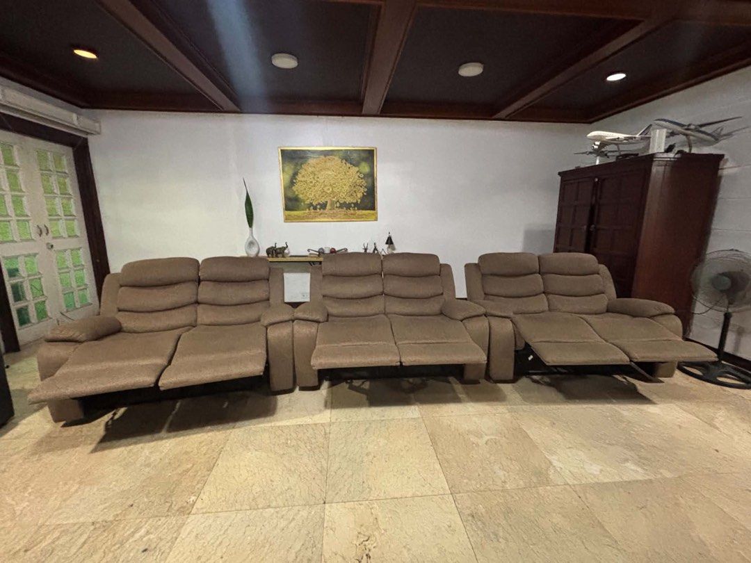 Brown Fabric Recliner Sofa Set (Category: Sofas) located in Las Pinas. Submitted by ringringms (Listing ID 1466230351, Image 1). Description: - Set of brown fabric recliner set - Each has it’s own pull-out footrests - Comfortable plush cushioning on backs and armrests - Manual pull handles on each sides for easy reclining - Neutral earth tone that blends well with most living room setups - Clean upholstery overall -Pre loved but Almost new - Read