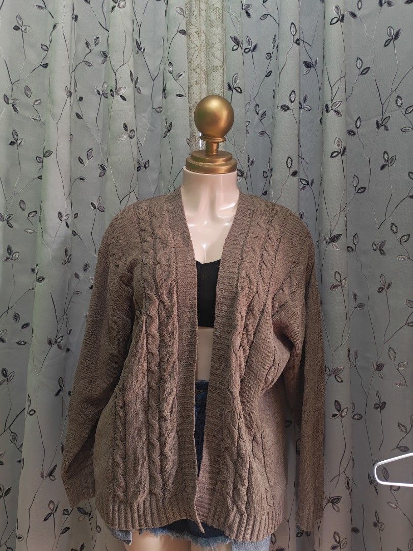 Brown Knit Open Front Cardigan Size L (Category: Coats, Jackets and Outerwear) located in Caloocan City. Submitted by _misskaye (Listing ID 1466160547, Image 2). Description: - Brand/Style: Cocovive brown open-front cardigan - Size: Large - Design: Chunky cable knit pattern down the front with long sleeves - Details: Ribbed cuffs and hem, soft textured material - Condition/Use: Cozy layer, easy to throw over tees or tanks for cooler days.