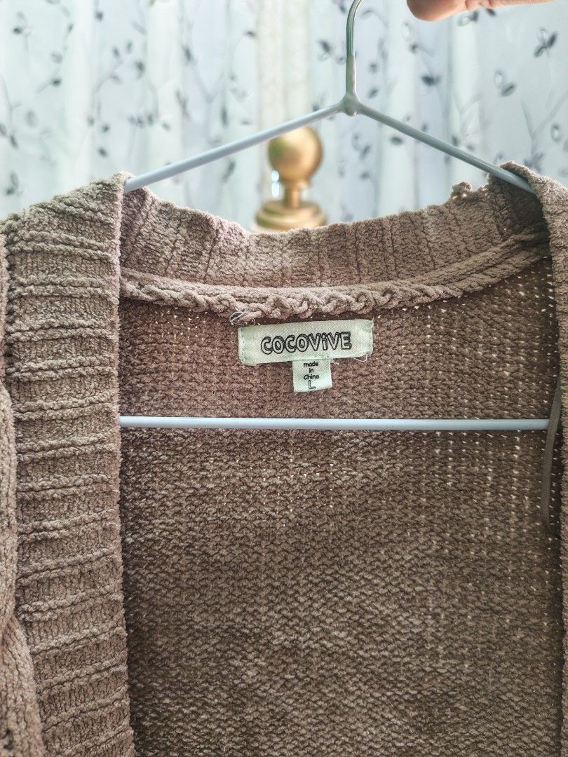 Brown Knit Open Front Cardigan Size L (Category: Coats, Jackets and Outerwear) located in Caloocan City. Submitted by _misskaye (Listing ID 1466160547, Image 3). Description: - Brand/Style: Cocovive brown open-front cardigan - Size: Large - Design: Chunky cable knit pattern down the front with long sleeves - Details: Ribbed cuffs and hem, soft textured material - Condition/Use: Cozy layer, easy to throw over tees or tanks for cooler days.