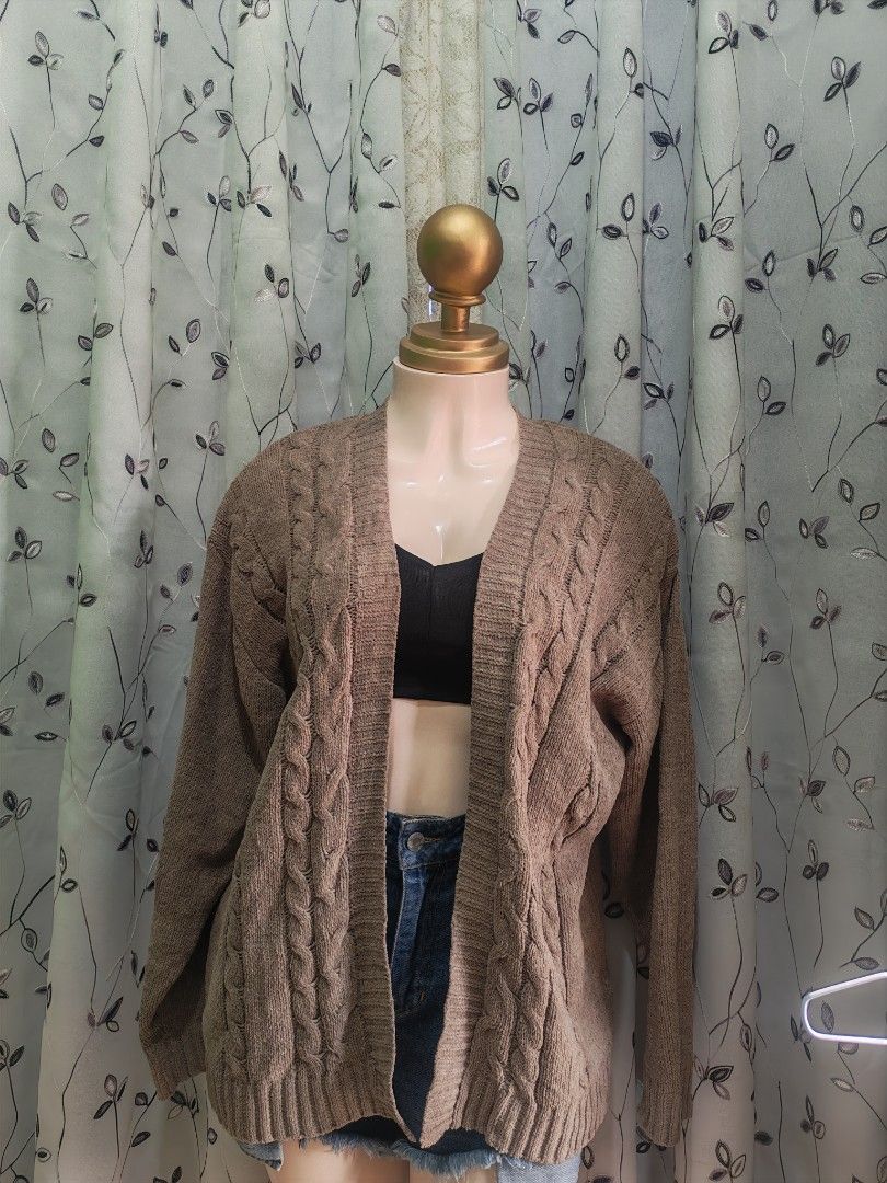 Brown Knit Open Front Cardigan Size L (Category: Coats, Jackets and Outerwear) located in Caloocan City. Submitted by _misskaye (Listing ID 1466160547, Image 1). Description: - Brand/Style: Cocovive brown open-front cardigan - Size: Large - Design: Chunky cable knit pattern down the front with long sleeves - Details: Ribbed cuffs and hem, soft textured material - Condition/Use: Cozy layer, easy to throw over tees or tanks for cooler days.