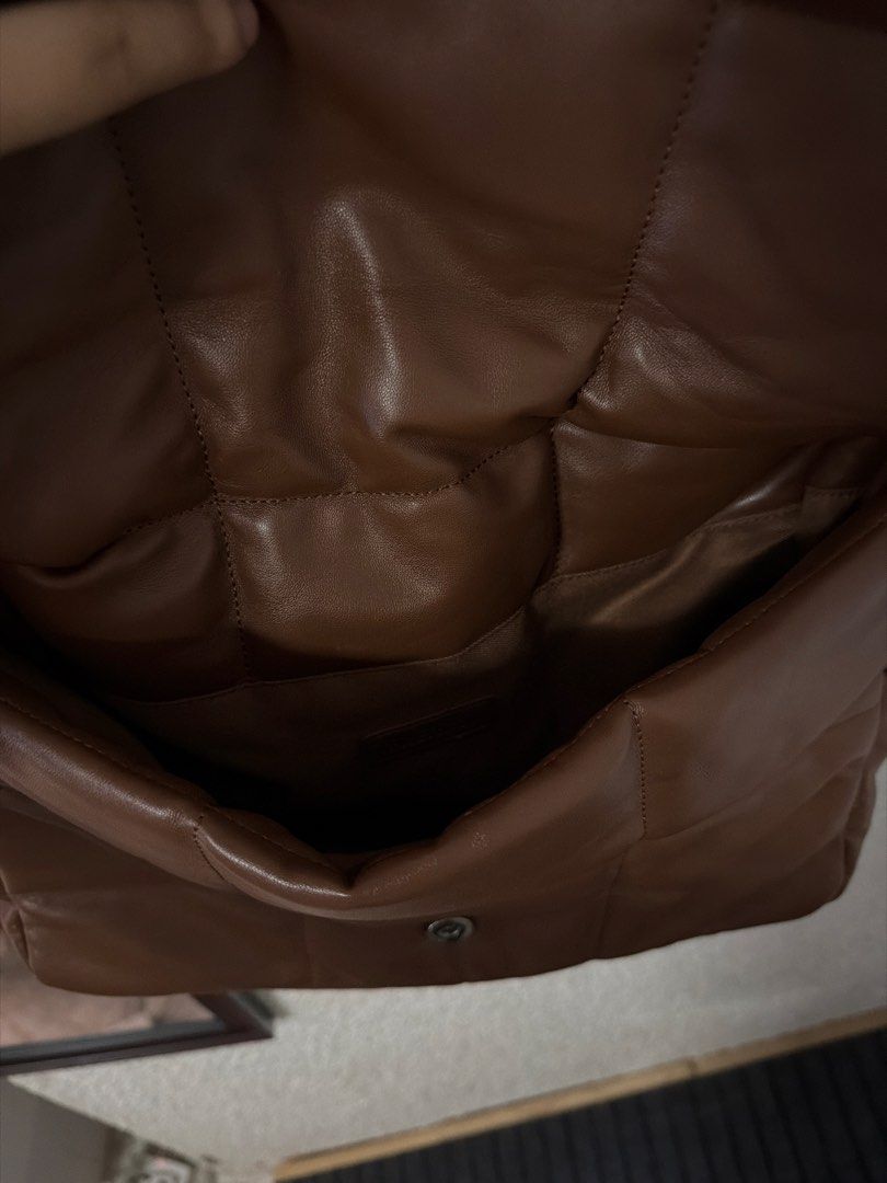 Brown Puffer Quilted Shoulder Bag (Category: Shoulder Bags) located in Angeles City. Submitted by irishholm (Listing ID 1466215830, Image 3). Description: - Used once. In Excellent condition - Brown faux leather shoulder bag - Trendy puffy, quilted grid pattern - Secure magnetic snap front flap closure - Comfortable wide strap for easy shoulder wear - Clean interior with a main compartment and extra organization pockets.