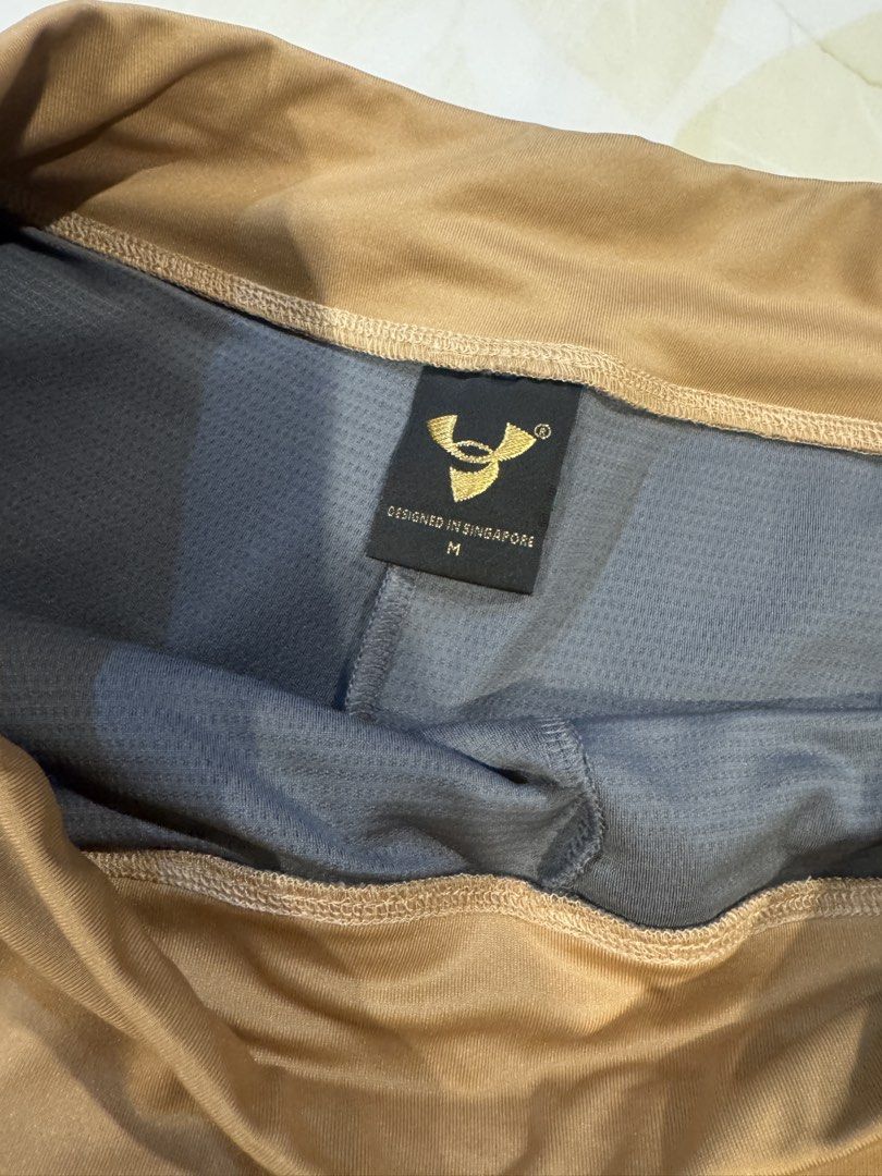 Brown sports Skort Size M (Category: Skirts) located in Muntinlupa City. Submitted by myabcshop (Listing ID 1466301891, Image 3). Description: - Item: Brown athletic skort with built-in shorts - Size: M (Designed in Singapore label) - Material: Smooth, stretchy fabric for maximum comfort - Features: Convenient side pockets - Best For: Tennis, golf, or casual daily wear - Condition: Excellent, worn only a couple of times, no stains or tears Pictur