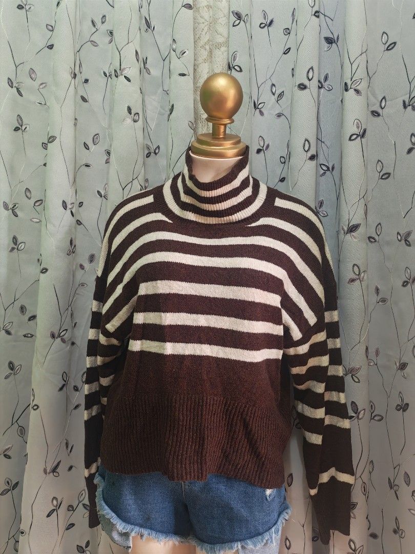 Brown Striped Turtleneck Sweater Size M (Category: Longsleeves) located in Caloocan City. Submitted by _misskaye (Listing ID 1466160485, Image 2). Description: - Brand: A New Day - Size: Medium - Color: Brown and cream stripes - Material: Thick, warm, and cozy knit - Details: Turtleneck, long drop shoulders, ribbed collar, cuffs, and hem - Style: Classic pullover, easy to match with any outfit.