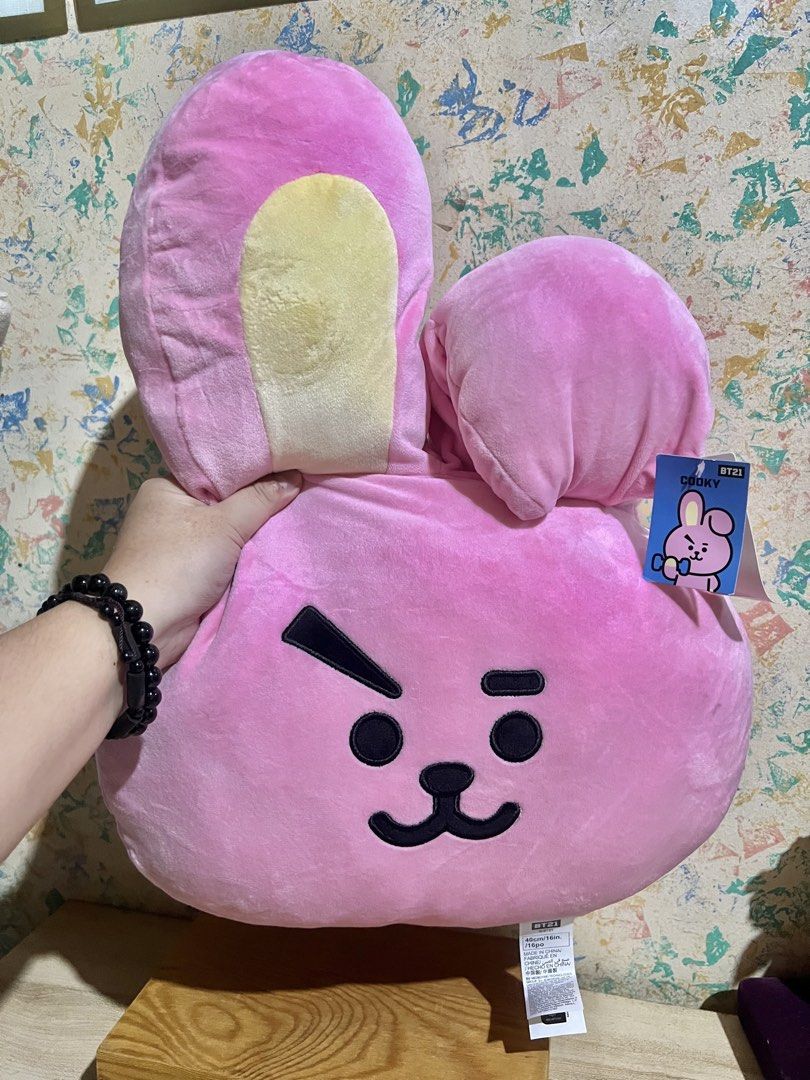BT21 x Miniso ~Cooky~ Face Cushion (Category: Plushies & Soft Toys) located in Taguig. Submitted by lae.onlineshop (Listing ID 1466273892, Image 2). Description: BT21 x Miniso ~Cooky~ Face Cushion *With etiketa and paper tag. Mallow-type *THE COLOR MAY SLIGHTLY DIFFER FROM ACTUAL DUE TO LIGHTING AND/OR SCREEN RESOLUTION. Size: approx 40cm (16”) Issue: mininmal cleaning needed, and may small flaw sa likod ng isang ear (see video), AS IS ‼️1 DAY RE