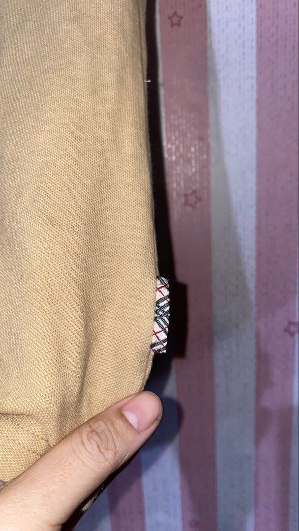 Burberry Blue Label vintage (Category: Blouses) located in President Roxas. Submitted by starksandmoon_ii (Listing ID 1466156913, Image 2). Description: - Brand: Burberry London Blue Label - Color: Camel Tan - Size: 40 - Details: Classic Nova Check collar and sleeve trim, red embroidered equestrian knight logo, silver-tone snap buttons - Material: Quality cotton, strecthy - Condition: with bleach stains na hindi naman masyadonh obvious.
