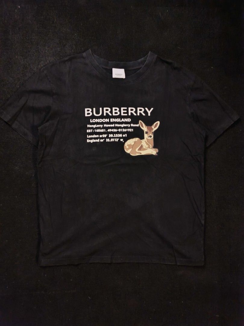 Burberry London England Script (Category: Tshirts & Polo Shirts ) located in San Fernando. Submitted by gaboo_asncn (Listing ID 1466324268, Image 2). Description: - Burberry London England Script - Size: Medium on tag (W22/L27) - Condition: Excellent - Color Rate: 9/10 - No Issue (Need Wash) Take note: The shirt is black, and since the carpet/background is also black, the color may look slightly faded or less vibrant in the photos. In actual ligh