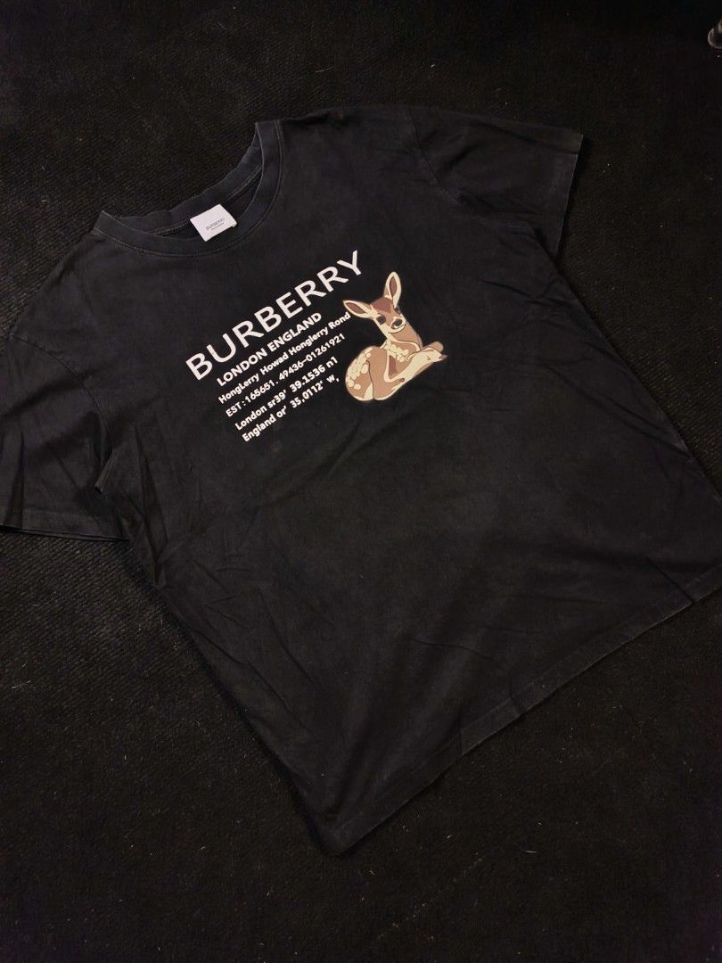 Burberry London England Script (Category: Tshirts & Polo Shirts ) located in San Fernando. Submitted by gaboo_asncn (Listing ID 1466324268, Image 1). Description: - Burberry London England Script - Size: Medium on tag (W22/L27) - Condition: Excellent - Color Rate: 9/10 - No Issue (Need Wash) Take note: The shirt is black, and since the carpet/background is also black, the color may look slightly faded or less vibrant in the photos. In actual ligh