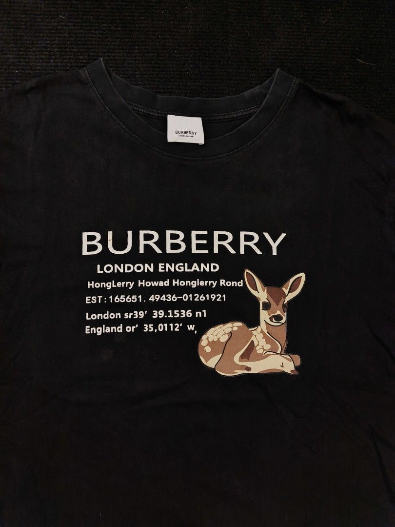 Burberry London England Script (Category: Tshirts & Polo Shirts ) located in San Fernando. Submitted by gaboo_asncn (Listing ID 1466324268, Image 3). Description: - Burberry London England Script - Size: Medium on tag (W22/L27) - Condition: Excellent - Color Rate: 9/10 - No Issue (Need Wash) Take note: The shirt is black, and since the carpet/background is also black, the color may look slightly faded or less vibrant in the photos. In actual ligh