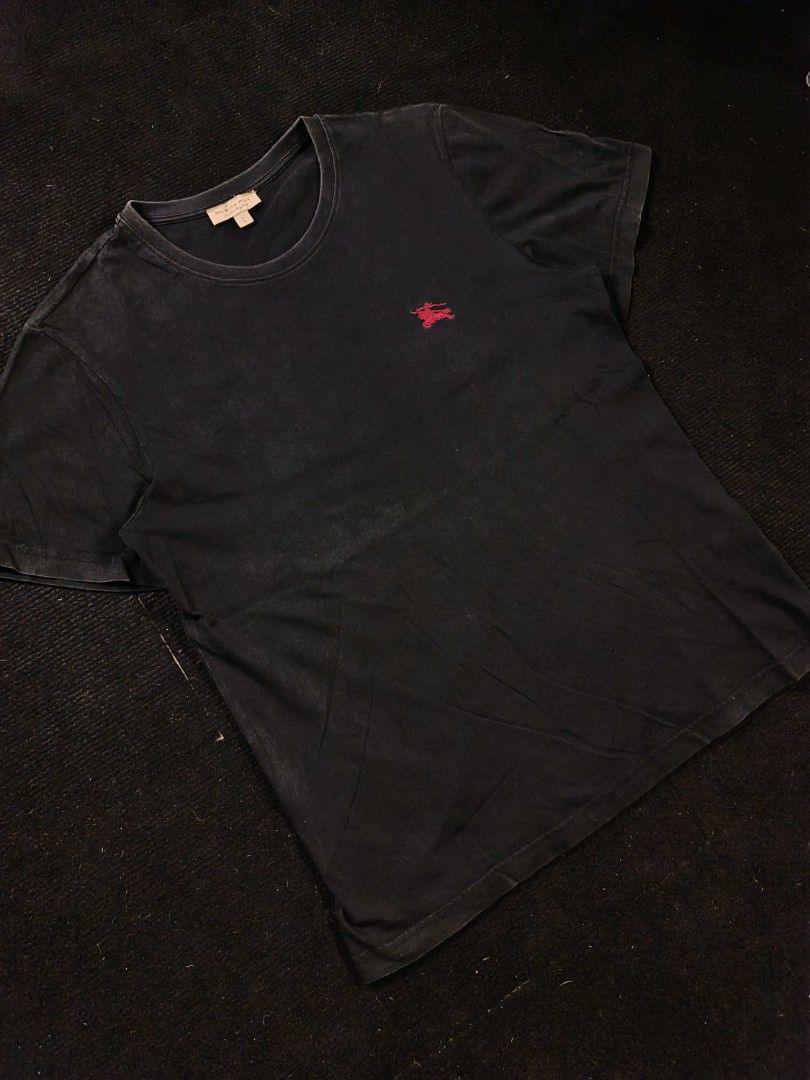 Burberry Red logo (Category: Tshirts & Polo Shirts ) located in San Fernando. Submitted by gaboo_asncn (Listing ID 1466325356, Image 1). Description: - Burberry Red logo - Size: Large on tag (W21/L28) - Condition: Excellent - Color Rate: 9/10 - No Issue Take note: The shirt is black, and since the carpet/background is also black, the color may look slightly faded or less vibrant in the photos. In actual lighting, the shirt has a normal black colo