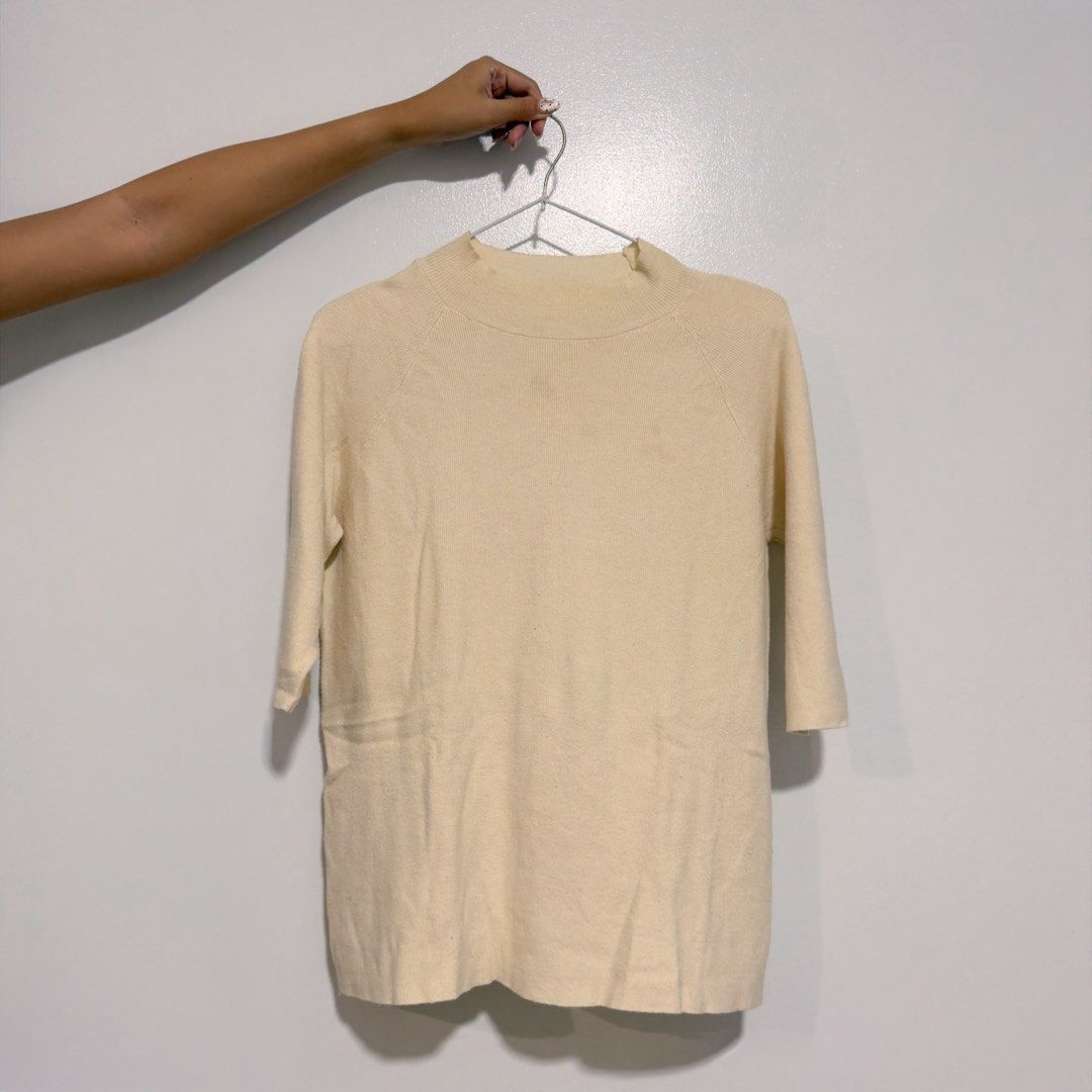 buttermilk knitted top (Category: Blouses) located in Cebu City. Submitted by cuteoncue (Listing ID 1466318411, Image 2). Description: large-xl please see last photo for washable stains. the item was freshly laundered but not soaked or stain-treated..