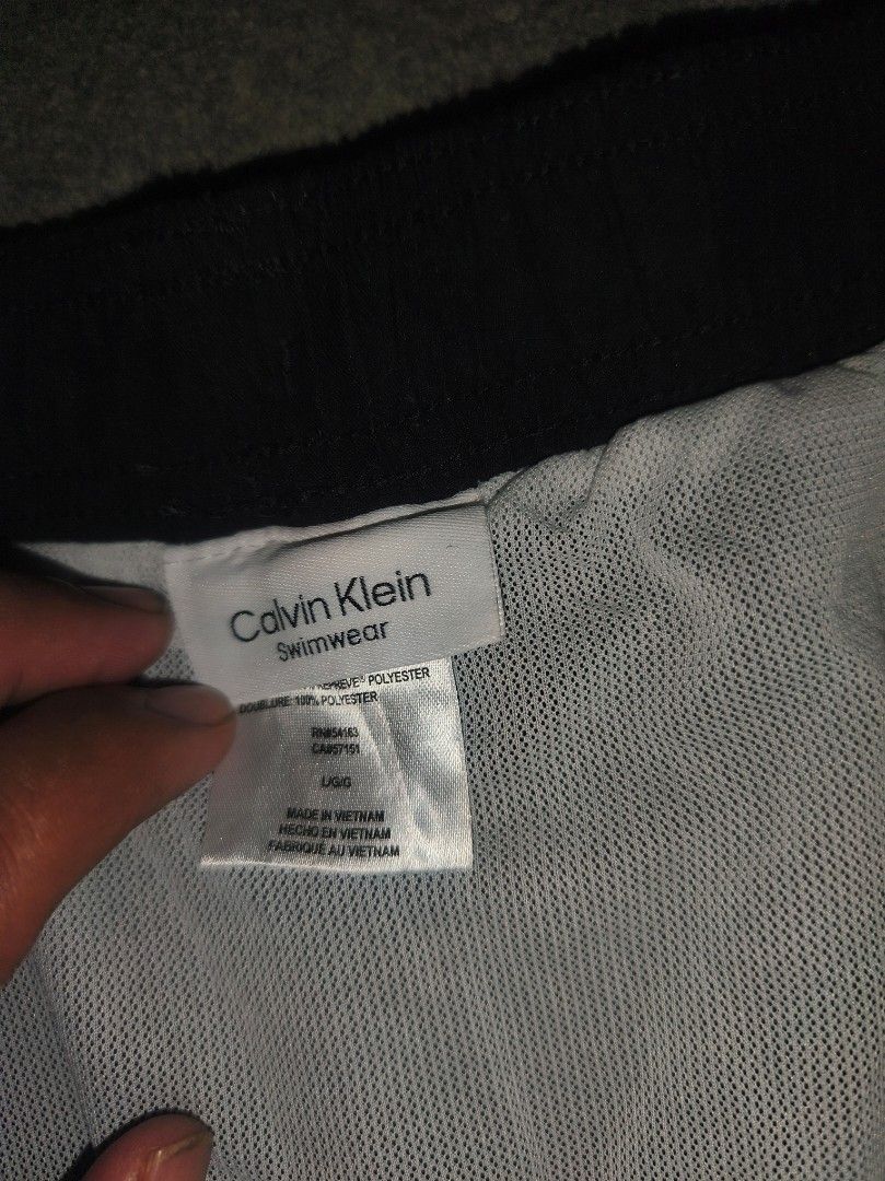 Calvin Klein Shorts Black Large (Category: Swim Trunks & Board Shorts) located in Cagayan de Oro. Submitted by adamfitz (Listing ID 1466166443, Image 3). Description: - Brand: Calvin Klein - Color: Black with white logo print down the left leg - Size: Large (L) - Material: 100% Repreve recycled polyester - Lining: Comfortable inner mesh lining - Features: Drawstring waistband with branded tips - Origin: Made in Vietnam - Condition: excellent cond