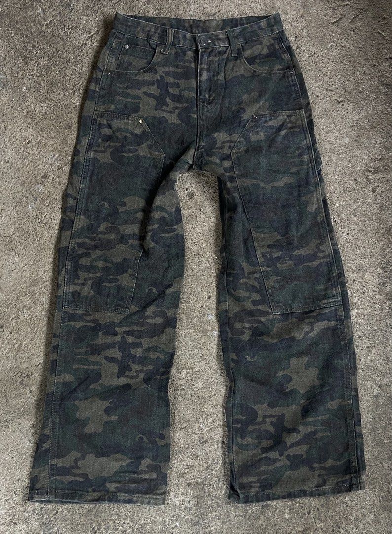 Camouflage Pants Carpenter Jeans (Category: Jeans) located in Polomolok. Submitted by tnecniv311 (Listing ID 1466276611, Image 1). Description: - Design: Classic green and black camo pattern - Style: Carpenter fit with straight legs - Features: Functional utility pockets and side hammer loop - Material: Durable heavy-duty cotton - Waist: Button closure with belt loops - Condition: Ready to wear.