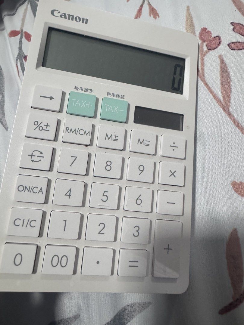 Canon HS-1200TC Desktop Calculator (Category: Office & Business Technology) located in Manila. Submitted by decluterthings888 (Listing ID 1466189183, Image 1). Description: - Model: Canon HS-1200TC desktop calculator - Colorway: Aesthetic pastel mint and white - Power: Dual powered (solar cell + CR2016 battery) - Functions: Tax calculation with rate setting keys and memory keys - Display: Large, clear screen with crisp text markings and clean but