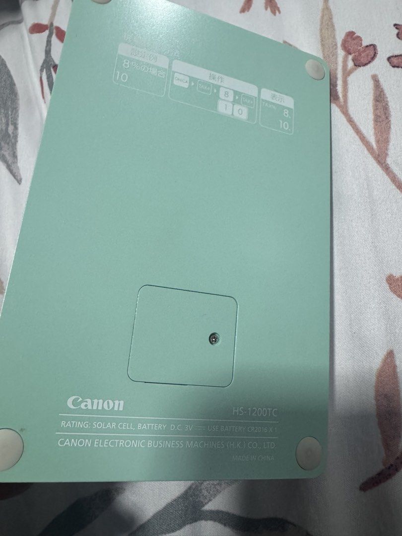 Canon HS-1200TC Desktop Calculator (Category: Office & Business Technology) located in Manila. Submitted by decluterthings888 (Listing ID 1466189183, Image 2). Description: - Model: Canon HS-1200TC desktop calculator - Colorway: Aesthetic pastel mint and white - Power: Dual powered (solar cell + CR2016 battery) - Functions: Tax calculation with rate setting keys and memory keys - Display: Large, clear screen with crisp text markings and clean but