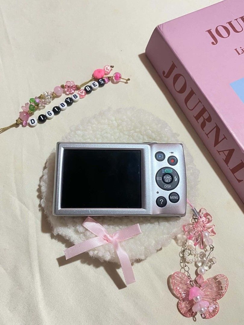CANON IXUS 145 DIGITAL CAMERA DIGICAM (Category: Cameras) located in Manila. Submitted by jade_snap (Listing ID 1466304592, Image 2). Description: ✧⁠* CANON IXUS 145 - sharp outputs ♡ ₱4,499 READY TO USE lcd leak (doesn't affect the output) 🩰Specs: *.' 16 MP *.' 8x optical zoom *.' ISO 80 to 1600 *.' CCD sensor 🎞️ Condition: ७९ all buttons are working, zoom, and flash ७९ body condition: 9/10 ७९ no port cover 👛 Ready to use! ७९ Inclusions - uni