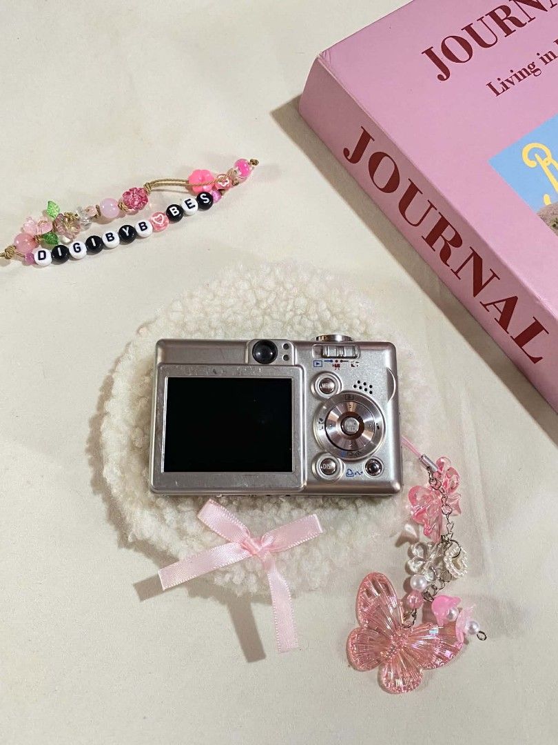 CANON IXUS 40 DIGITAL CAMERA DIGICAM (Category: Cameras) located in Manila. Submitted by jade_snap (Listing ID 1466304293, Image 2). Description: ✧⁠* CANON IXUS 40 ♡ ₱3,499 READY TO USE lcd burn (doesn't affect the output) 🩰Specs: *.' 7.1 MP *.' 3x optical zoom *.' ISO 80 to 1000 *.' CCD sensor 🎞️ Condition: ७९ all buttons are working, zoom, and flash ७९ body condition: 8/10 faded paints ७९ no port cover 👛 Ready to use! ७९ Inclusions - unit - 