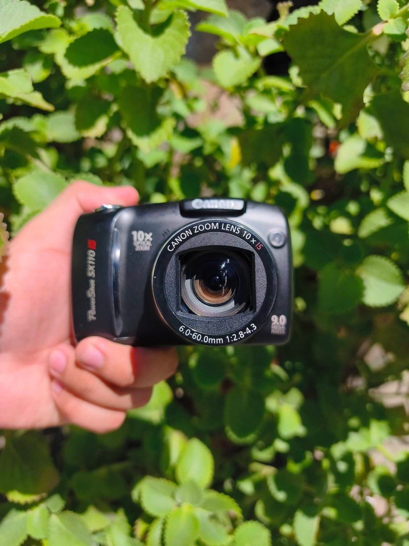 Canon PowerShot SX110 IS Digital Camera (Category: Cameras) located in Manila. Submitted by caliii1 (Listing ID 1466171884, Image 3). Description: - Model: Canon PowerShot SX110 IS (Black) - Resolution: 9.0 Megapixels - Zoom: 10x Optical Zoom Lens with Image Stabilizer - Usability: Convenient top mode dial for auto, manual, and scene settings - Power: Uses standard batteries (super easy to replace!) - Design: Compact and travel-friendly body with