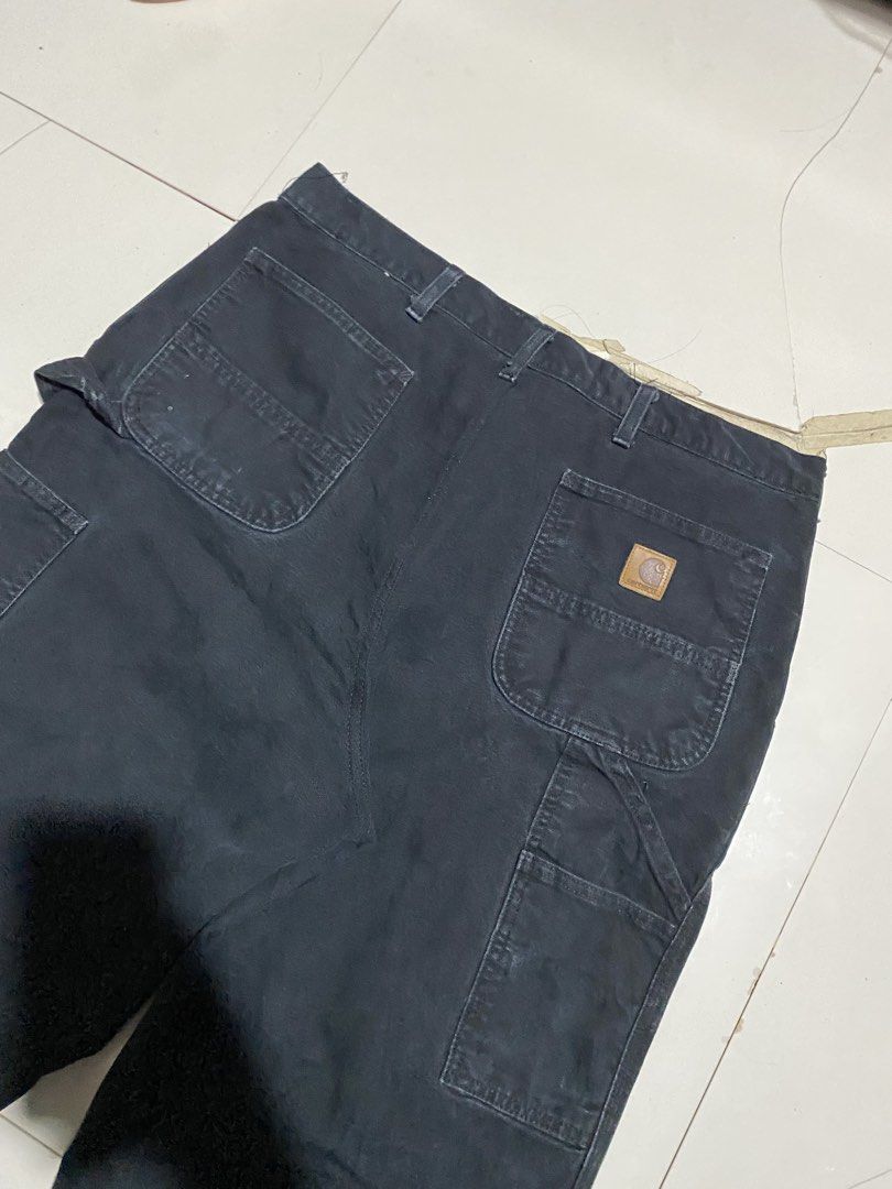 Carhartt Black Canvas Carpenter Work Pants (Category: Jeans) located in Antipolo. Submitted by cogiestamaria (Listing ID 1466263810, Image 3). Description: - Brand: Carhartt - Style: Double Knee Carpenter Pants - size 36-38 - Length 44 - Leg Opening 9.5 - no issue - color rate 9-10 - excellent condition - Color: Faded Black - Material: Heavy-duty cotton duck canvas - Features: Hammer loop, tool pockets, reinforced double knees - Condition: Faded 