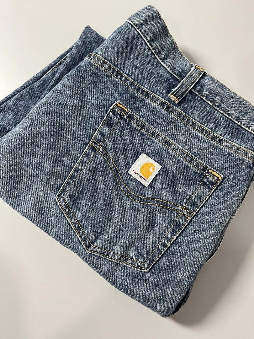 Carhartt Blue Denim Jeans (Category: Jeans) located in Manila. Submitted by nice430 (Listing ID 1466158991, Image 1). Description: - Brand: Carhartt - Color: Blue denim - Fit: Straight leg - Details: Classic contrast stitching, button closure, belt loops - Pockets: Standard front and back pockets with signature Carhartt square logo patch on the right rear - Condition: Wash wear throughout.