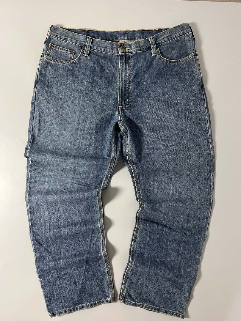 Carhartt Blue Denim Jeans (Category: Jeans) located in Manila. Submitted by nice430 (Listing ID 1466158991, Image 3). Description: - Brand: Carhartt - Color: Blue denim - Fit: Straight leg - Details: Classic contrast stitching, button closure, belt loops - Pockets: Standard front and back pockets with signature Carhartt square logo patch on the right rear - Condition: Wash wear throughout.